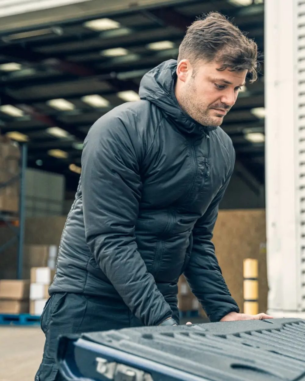 Black Coloured Viper Frontier Jacket on warehouse background 
