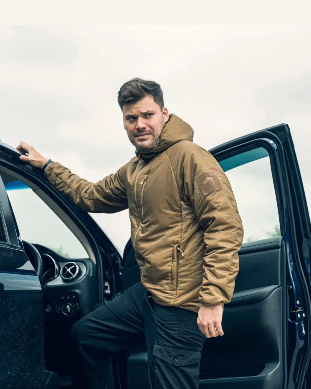 Dark Coyote Coloured Viper Frontier Jacket on car background 