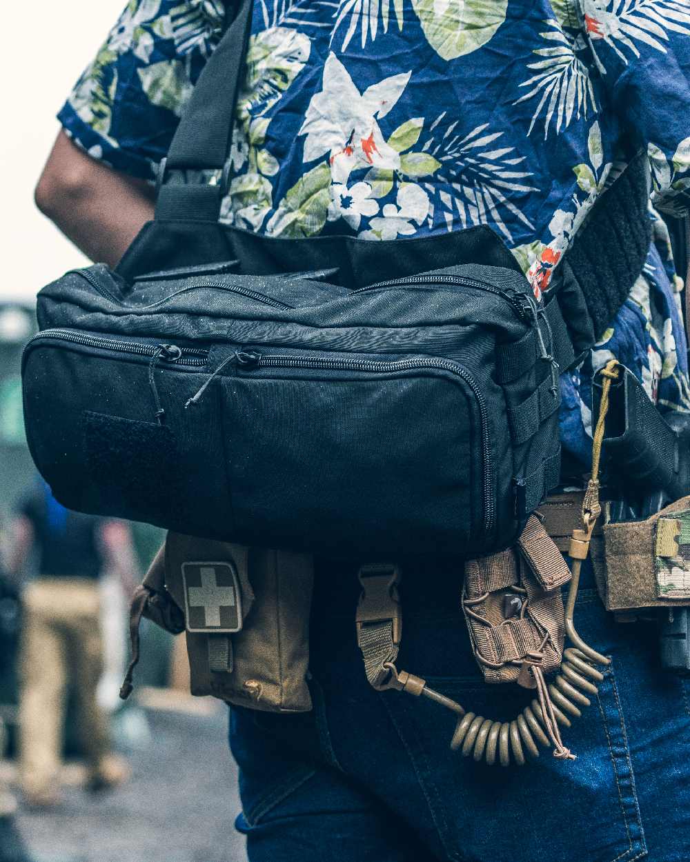 Black Coloured Viper VX Buckle Up Sling Pack on blurry background 