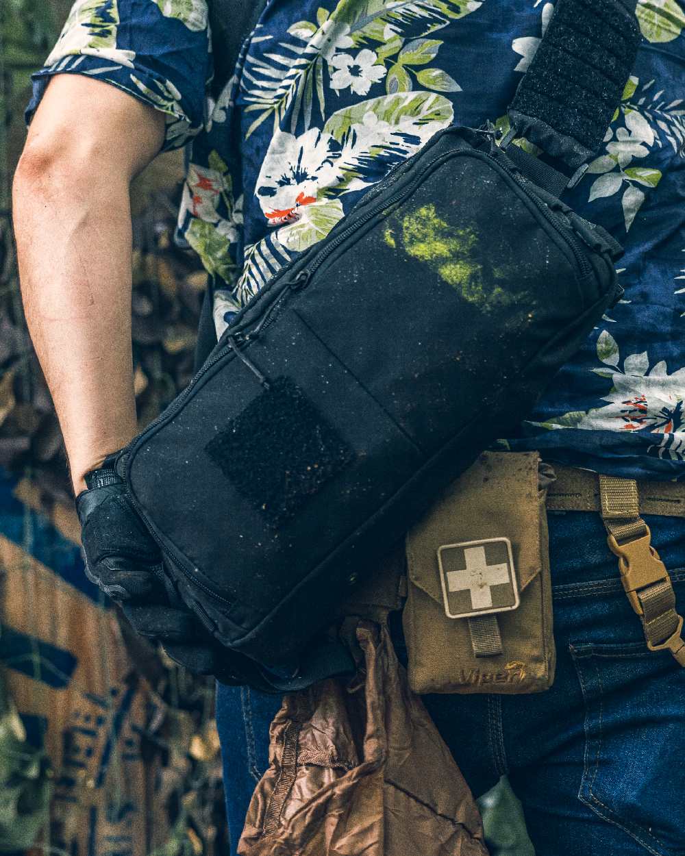 Black Coloured Viper VX Buckle Up Sling Pack on blurry background 
