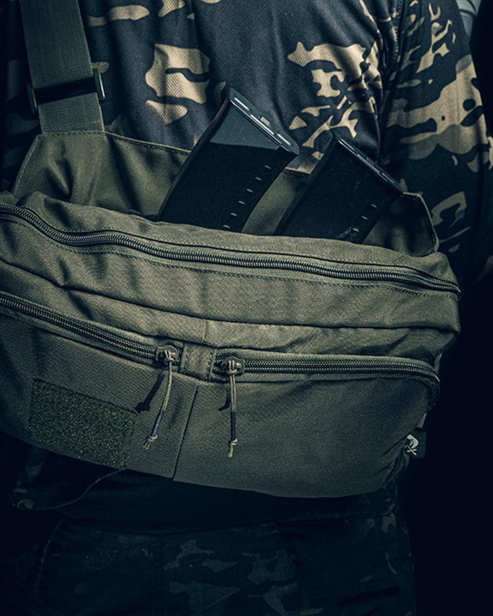 Green Coloured Viper VX Buckle Up Sling Pack on blurry background 