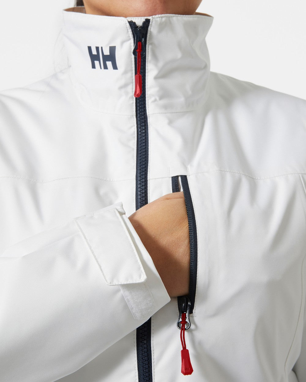 White coloured Helly Hansen Womens Crew Midlayer Sailing Jacket 2.0 on grey background 