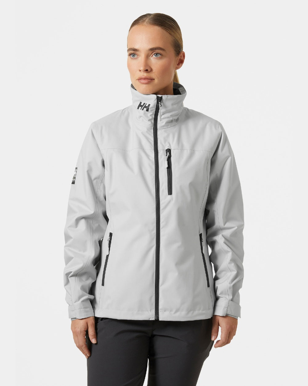 Grey Fog coloured Helly Hansen Womens Crew Midlayer Sailing Jacket 2.0 on grey background 