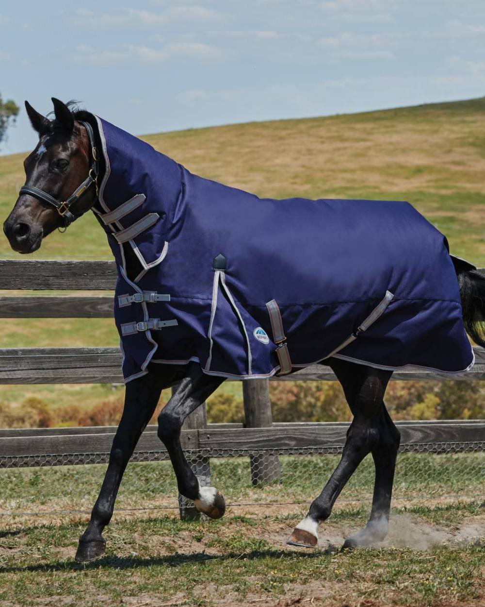 Navy Silver Red coloured WeatherBeeta ComFiTec Essential Combo Neck Heavy on hill background 