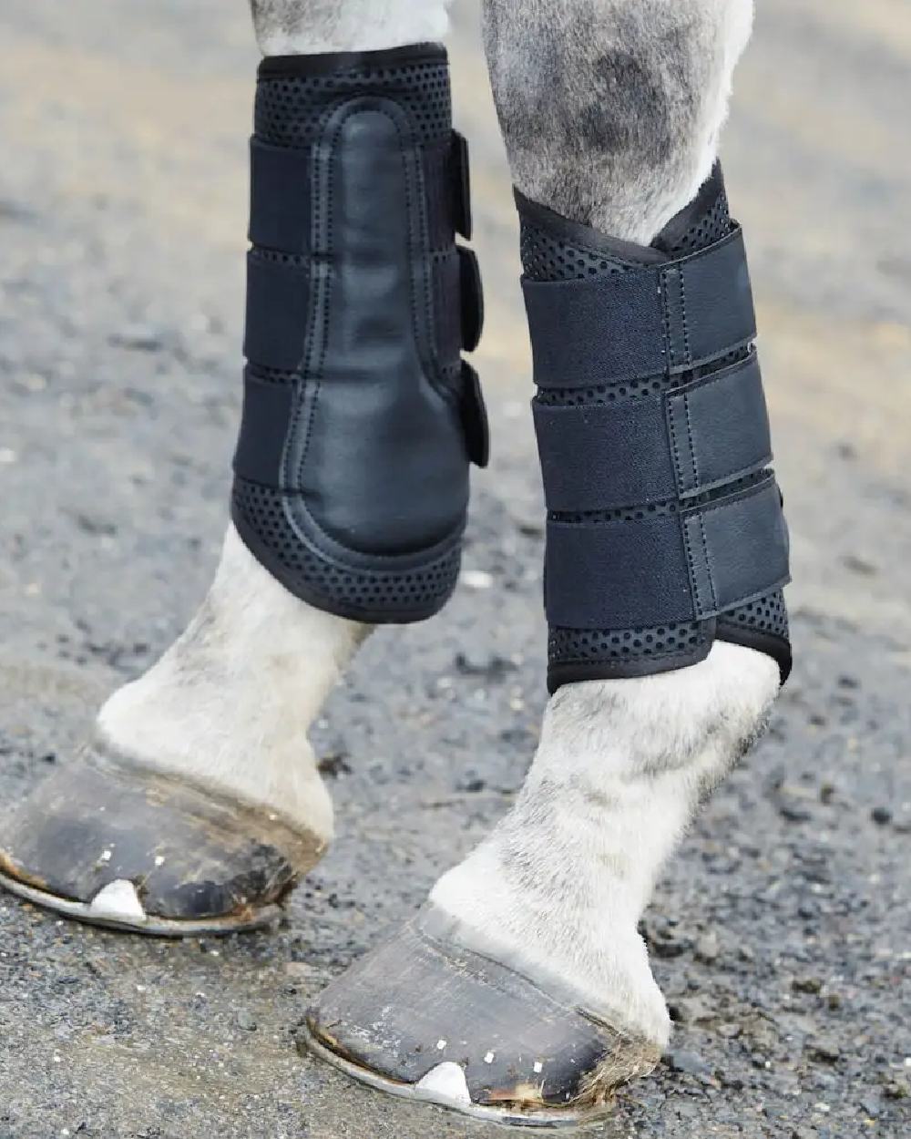 Black coloured WeatherBeeta Exercise Boots on blurry background 