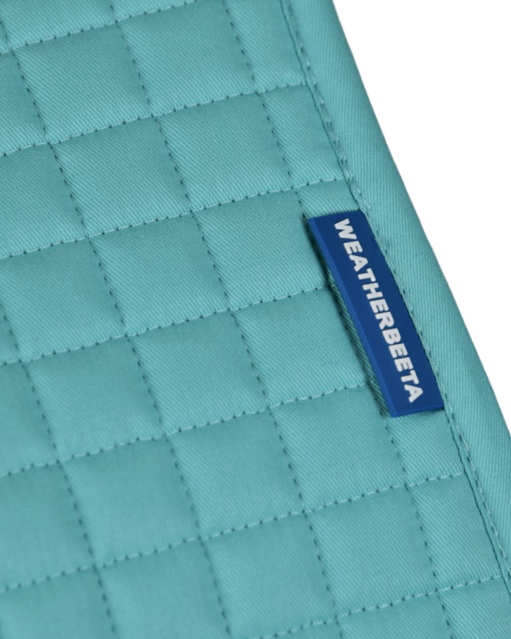 Light Aqua Coloured WeatherBeeta Prime Air-Tec Dressage Saddle Pad on white background 