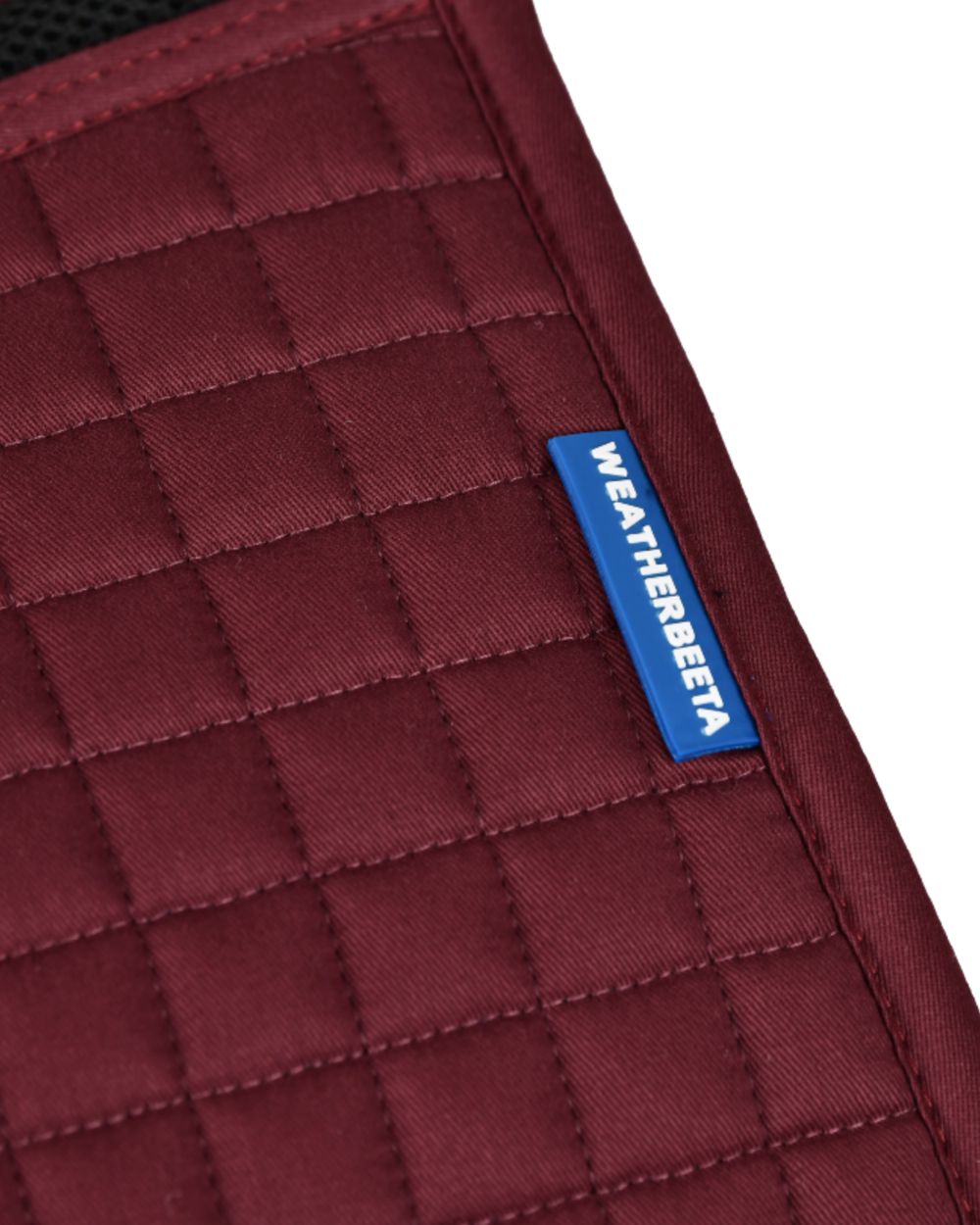 Burgundy Coloured WeatherBeeta Prime Air-Tec Jump Shaped Saddle Pad on white background 