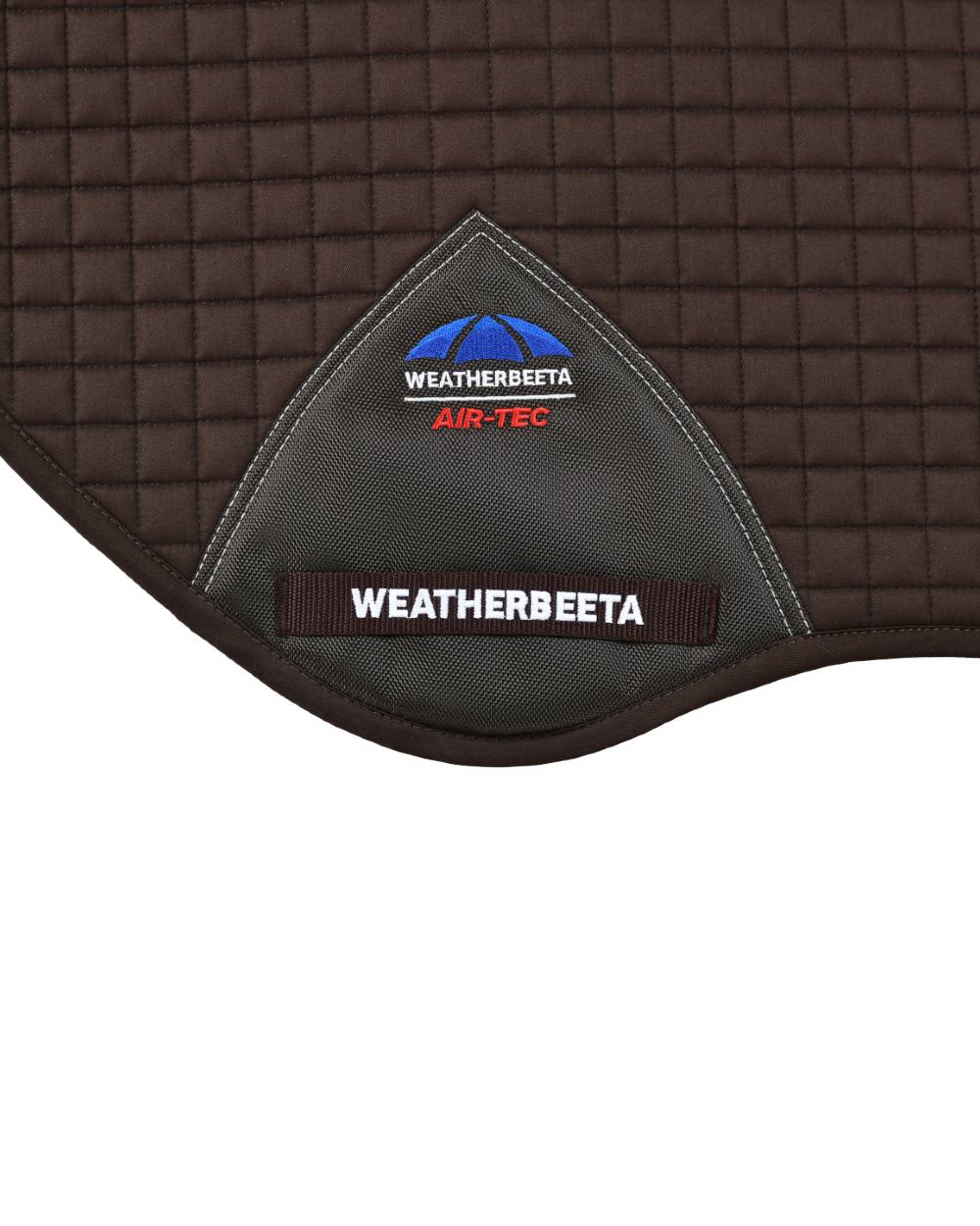 Chocolate Coloured WeatherBeeta Prime Air-Tec Jump Shaped Saddle Pad on white background 