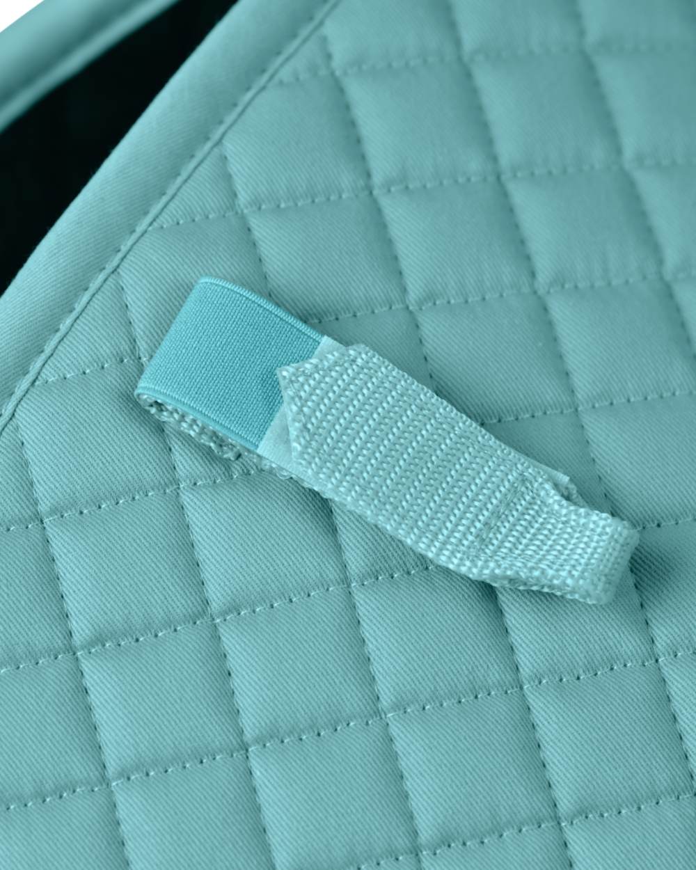 Light Aqua Coloured WeatherBeeta Prime Air-Tec Jump Shaped Saddle Pad on white background 