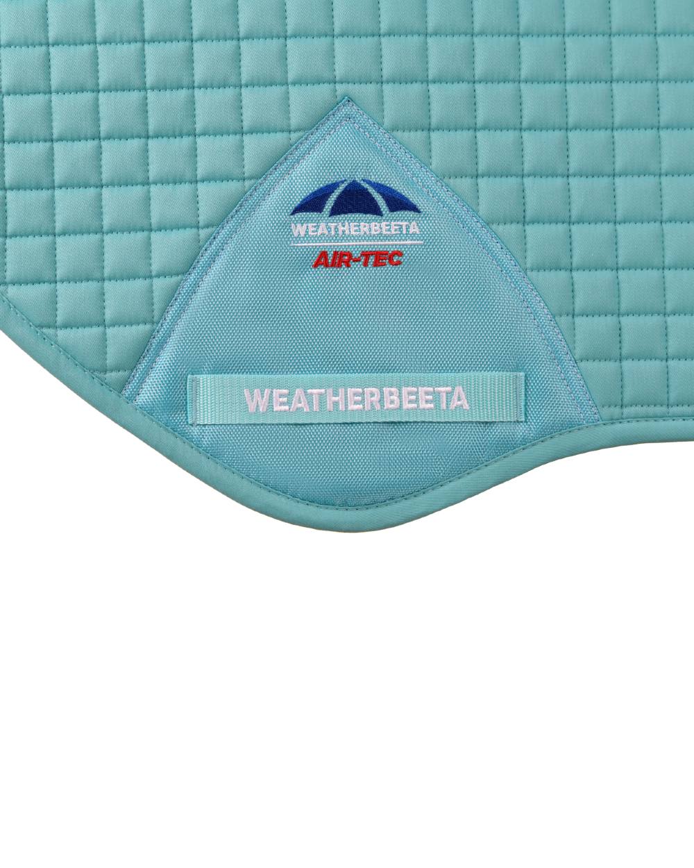 Light Aqua Coloured WeatherBeeta Prime Air-Tec Jump Shaped Saddle Pad on white background 