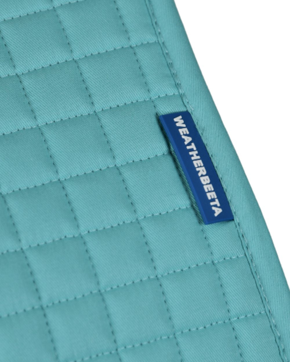 Light Aqua Coloured WeatherBeeta Prime Air-Tec Jump Shaped Saddle Pad on white background 