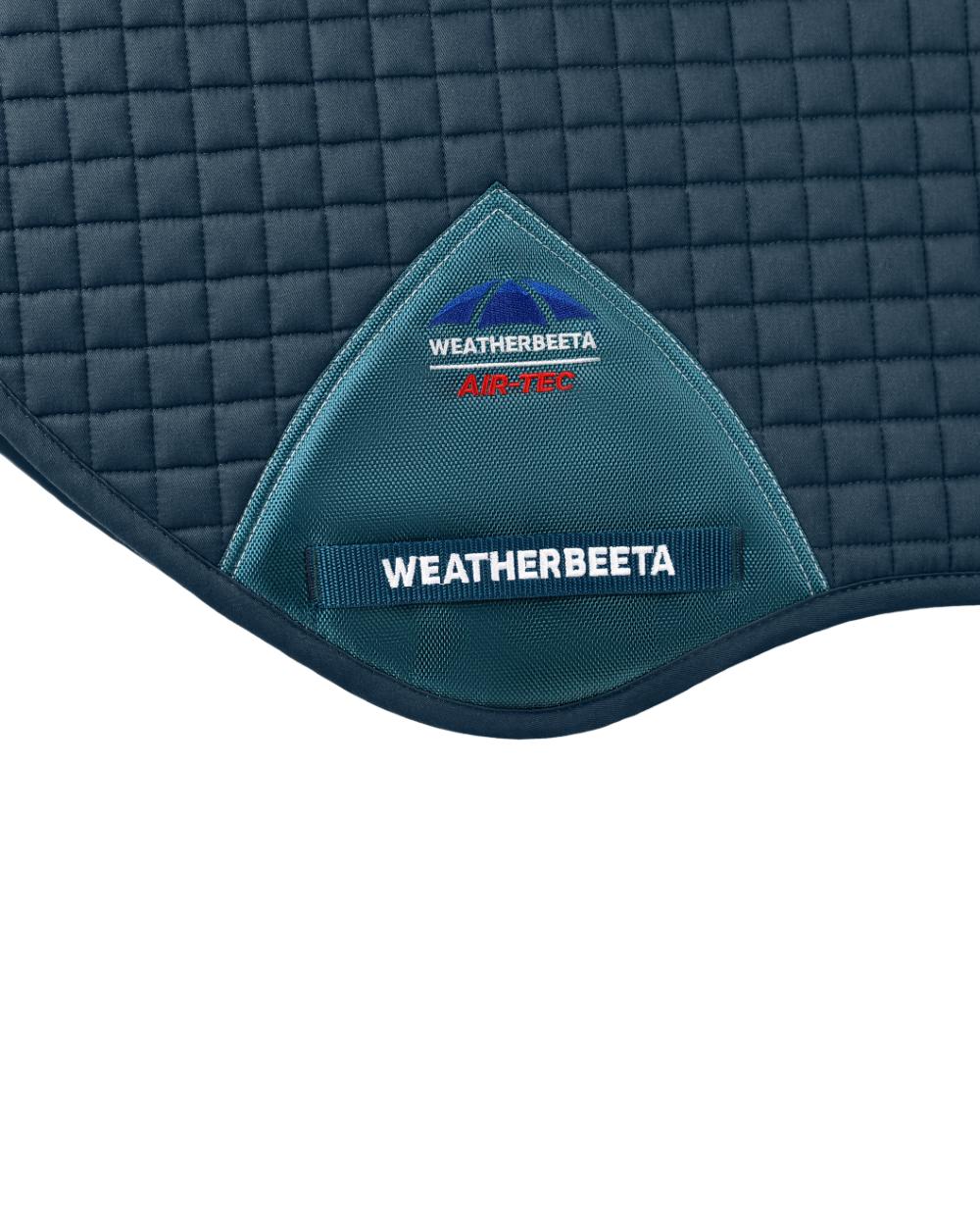 Midnight Teal Coloured WeatherBeeta Prime Air-Tec Jump Shaped Saddle Pad on white background 
