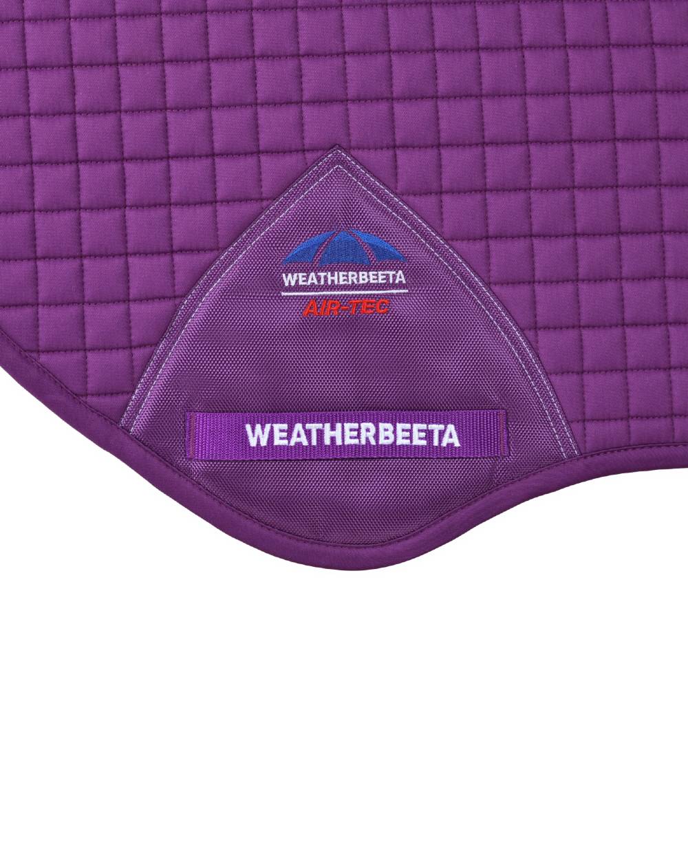 Violet Coloured WeatherBeeta Prime Air-Tec Jump Shaped Saddle Pad on white background 