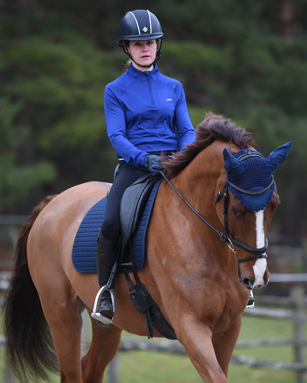 Navy coloured WeatherBeeta Prime Long Sleeve Top on blurry background 