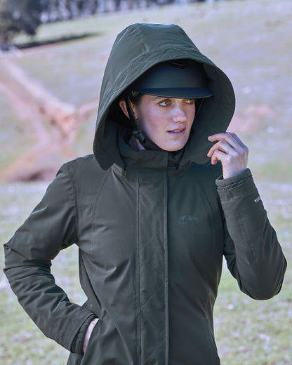 Midnight Green Coloured WeatherBeeta Womens All Purpose Waterproof Longline Equestrian Jacket on outdoor background 