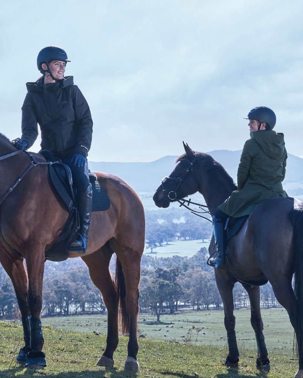 Midnight Green Coloured WeatherBeeta Womens All Purpose Waterproof Longline Equestrian Jacket on outdoor background 