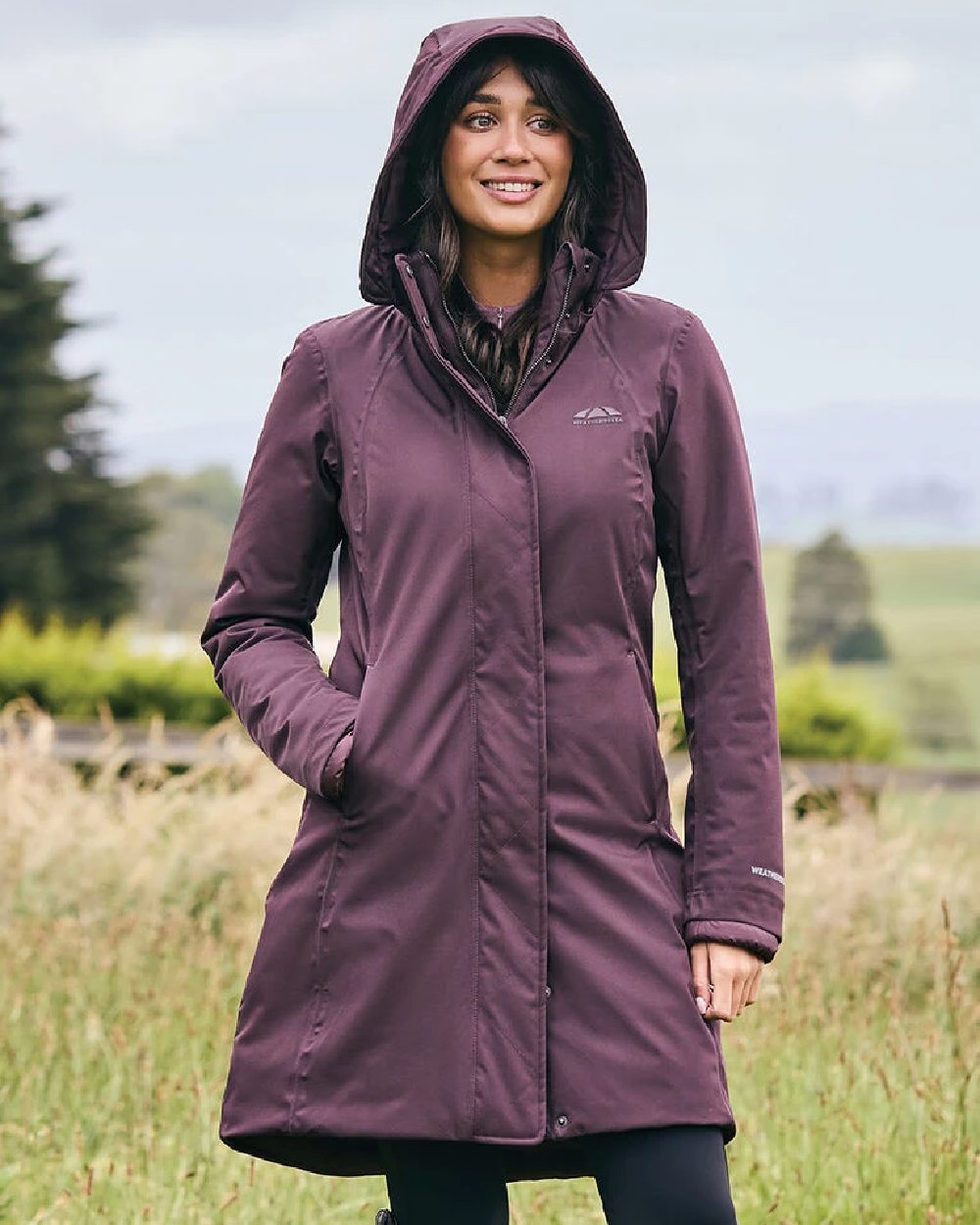 Mulberry Coloured WeatherBeeta Womens All Purpose Waterproof Longline Equestrian Jacket on outdoor background 