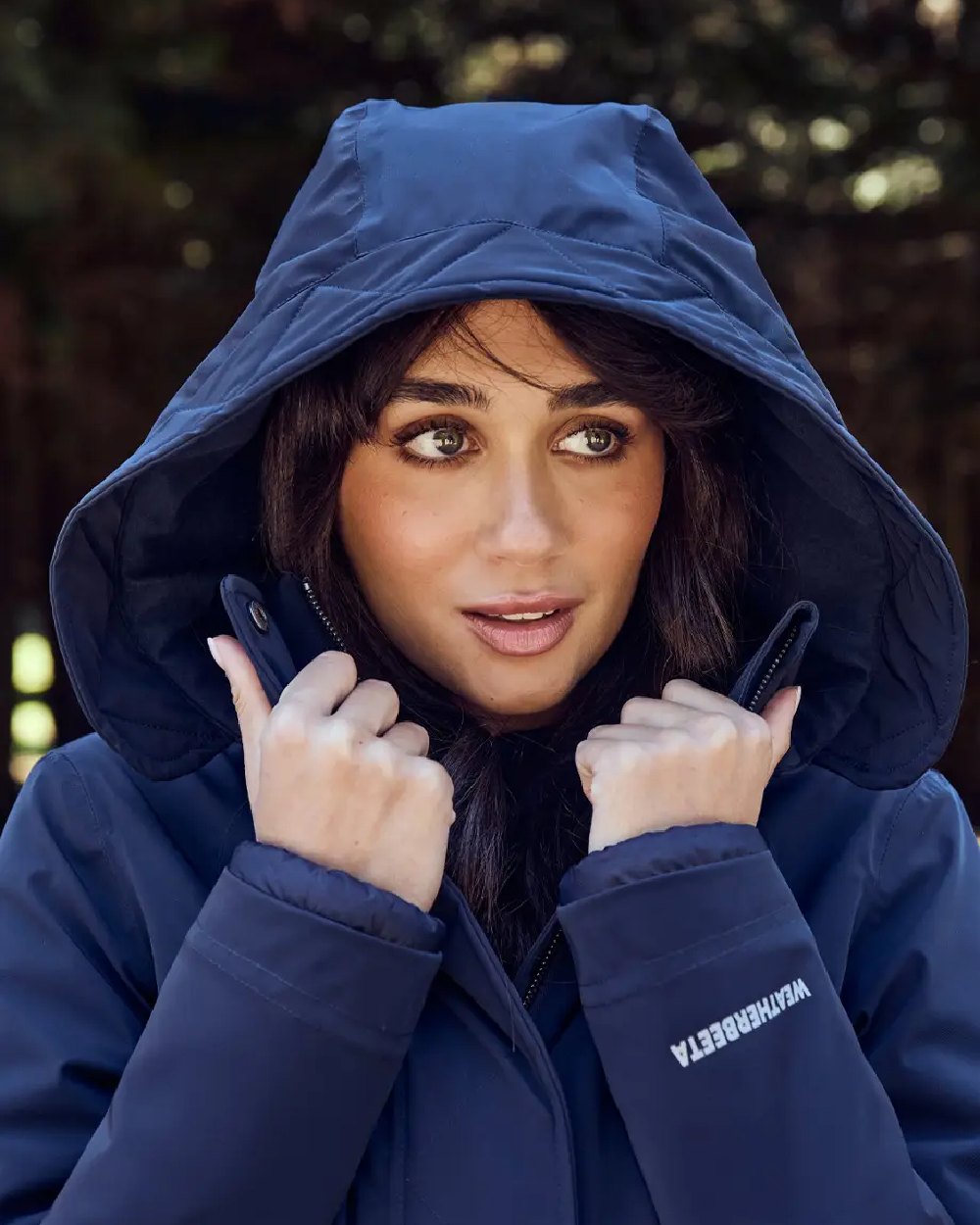 Navy Coloured WeatherBeeta Womens All Purpose Waterproof Longline Equestrian Jacket on outdoor background 