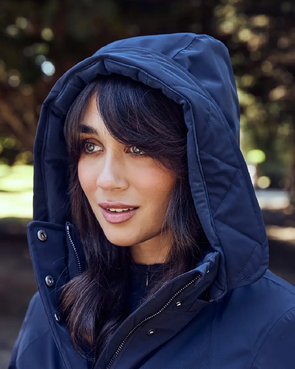 Navy Coloured WeatherBeeta Womens All Purpose Waterproof Longline Equestrian Jacket on outdoor background 