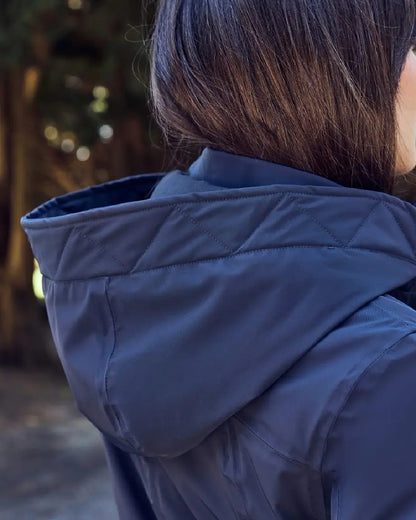 Navy Coloured WeatherBeeta Womens All Purpose Waterproof Longline Equestrian Jacket on outdoor background 