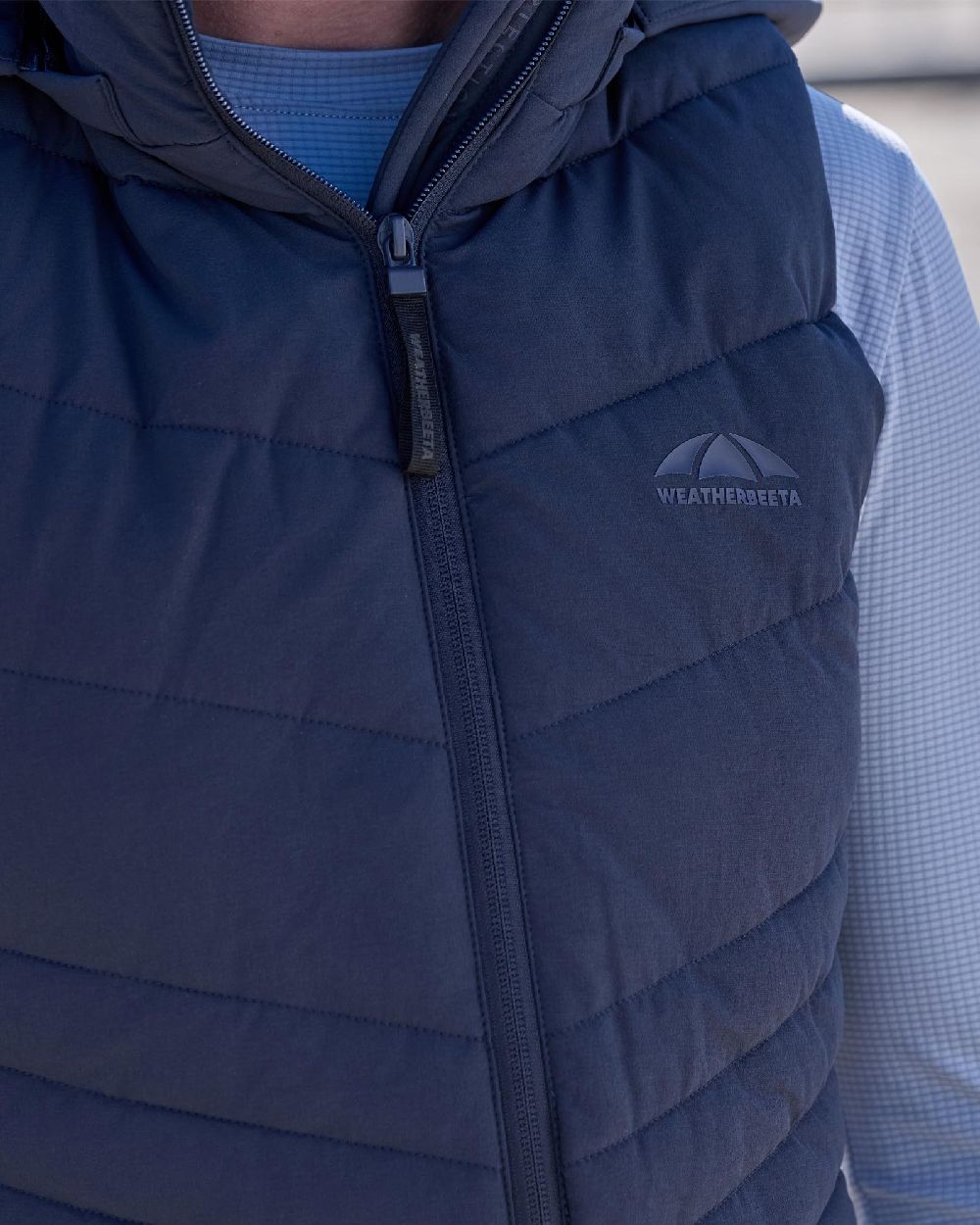 Navy Coloured WeatherBeeta Womens Insulated Vest on outdoor background 