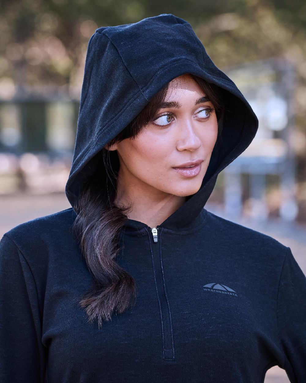 Dark Navy Marle Coloured WeatherBeeta Womens London Layer Long Sleeve Top With Hood on outdoor background 