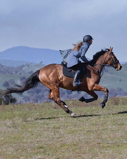 Slate Blue Coloured WeatherBeeta Womens Windbreaker Longline Riding Jacket on outdoor background 