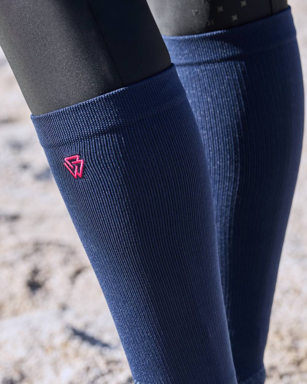 Navy Bright Pink coloured Weatherbeeta Compression Knee Length Riding Socks on outdoor background 