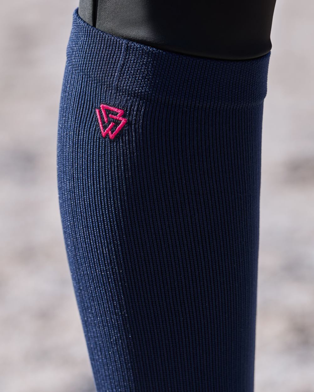 Navy Bright Pink coloured Weatherbeeta Compression Knee Length Riding Socks on outdoor background 