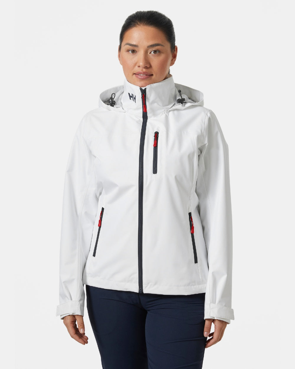 White coloured Helly Hansen womens crew hooded sailing jacket 2.0 on grey background 