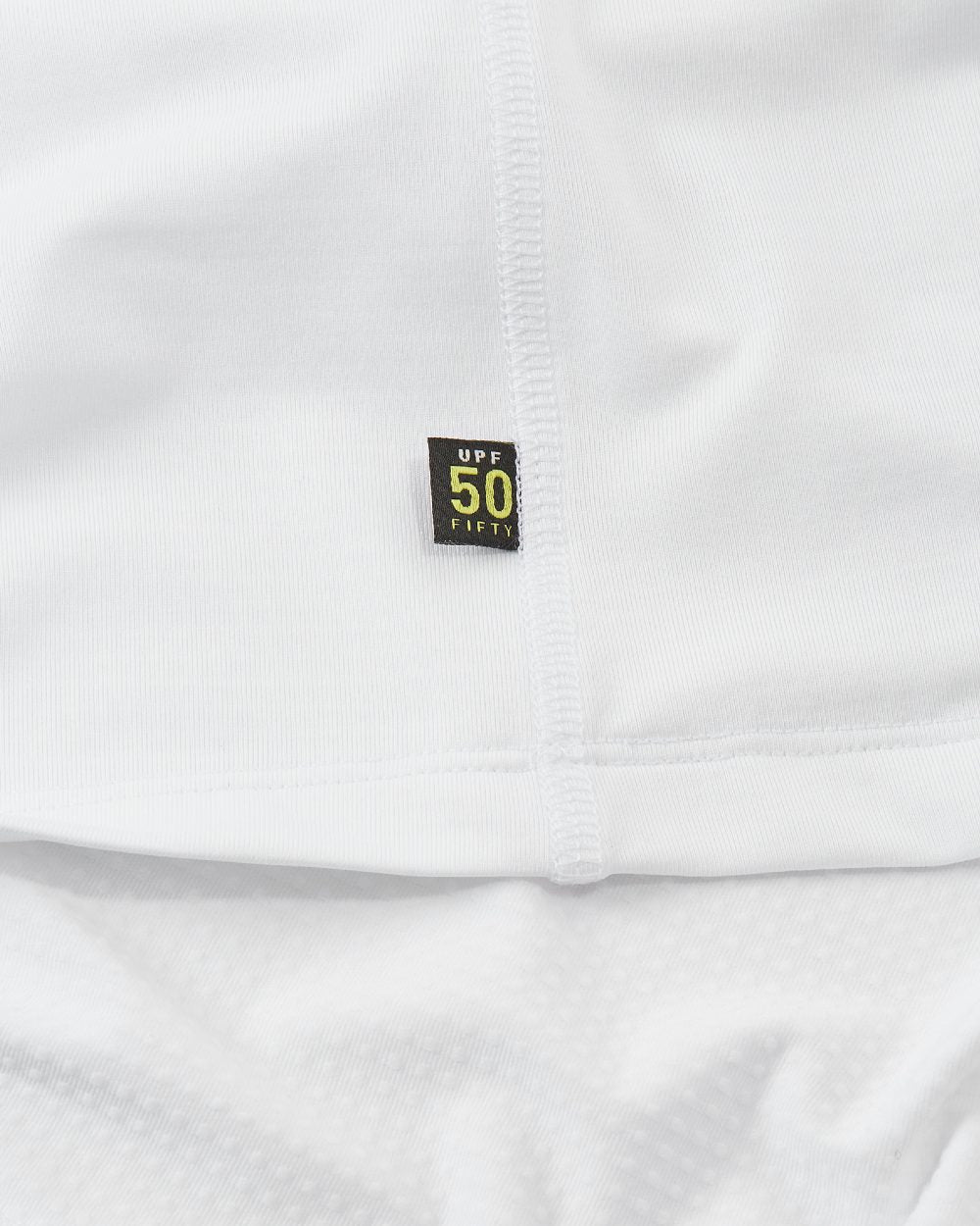 White Coloured Musto Evolution Sunblock Long Sleeve Polo Shirt 2.0 On A White Background 