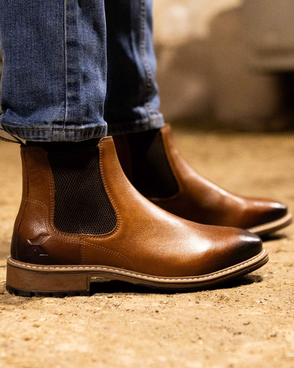 Tan coloured Xpert Mens Heritage Dexter Chelsea Boots on a sandy dirt floor 