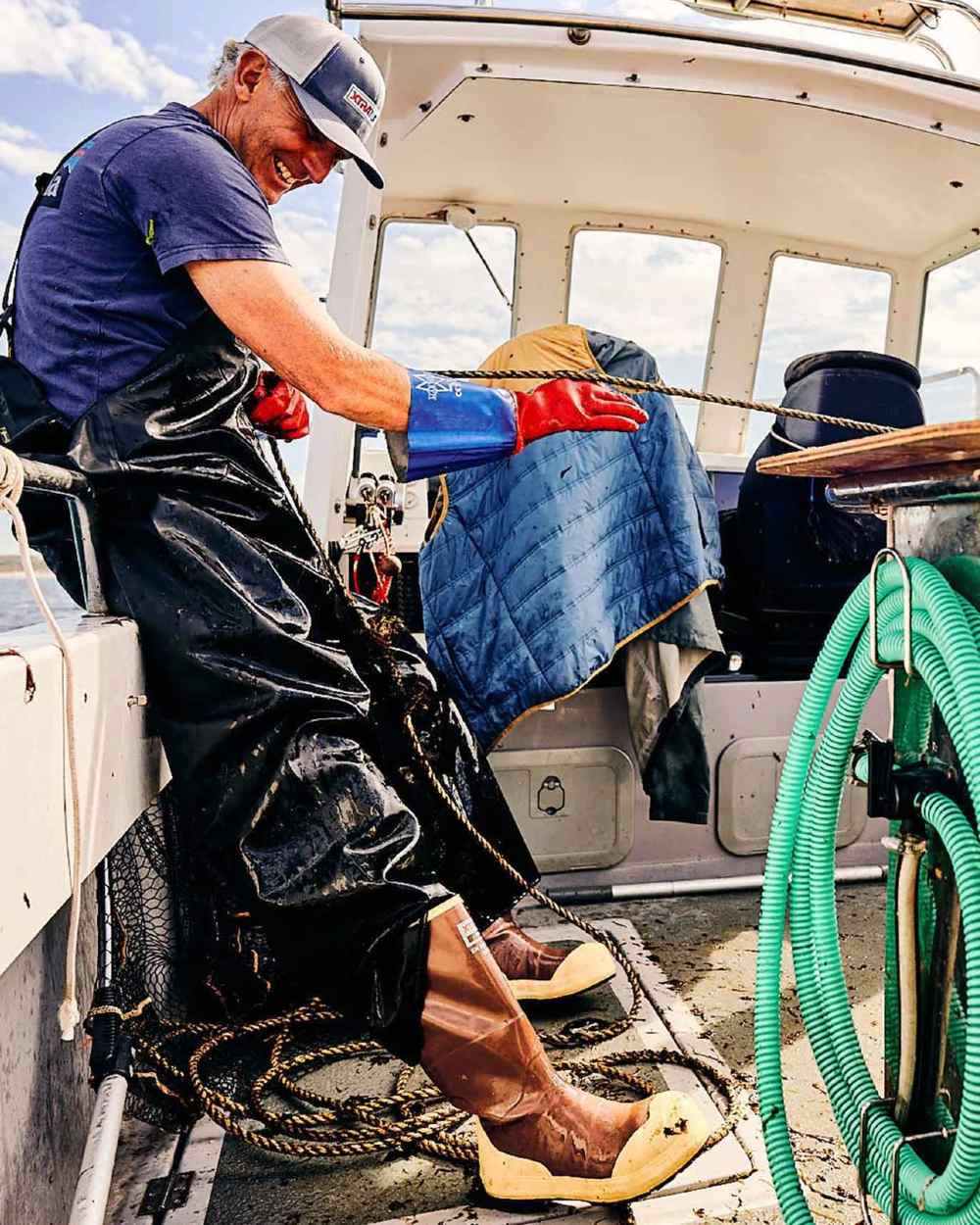 Brown Tan Coloured Xtratuf Legacy NXT Steel Toe Fishing Boots on outdoor background 