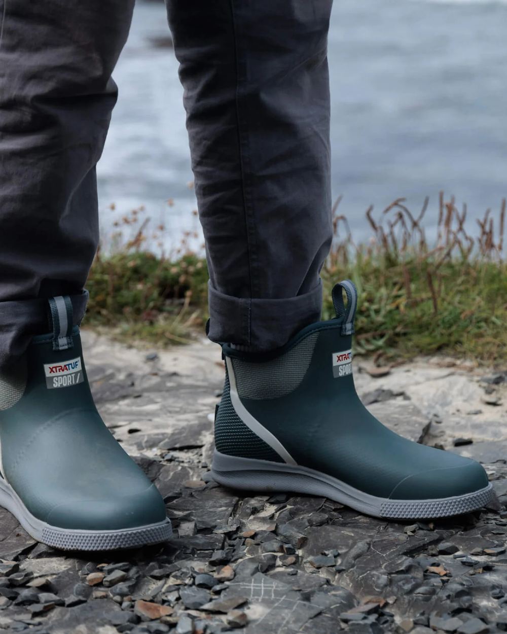 Stormy Coloured Xtratuf Mens 6" Ankle Deck Sport Boots on outdoor background 