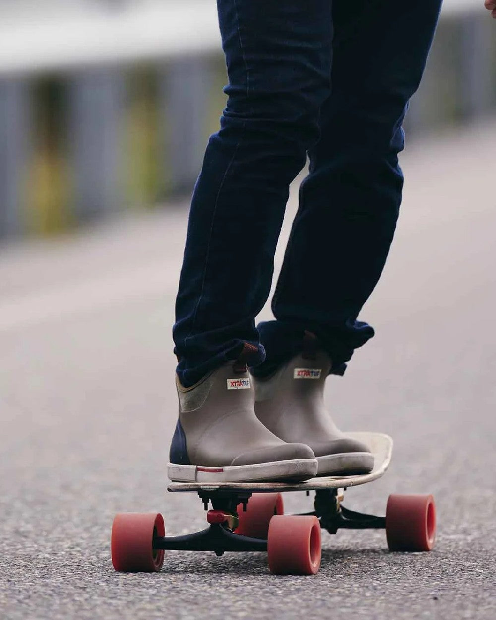 Vintage Olive Coloured Xtratuf Mens 6 Ankle Deck Vintage Boots on outdoor background 