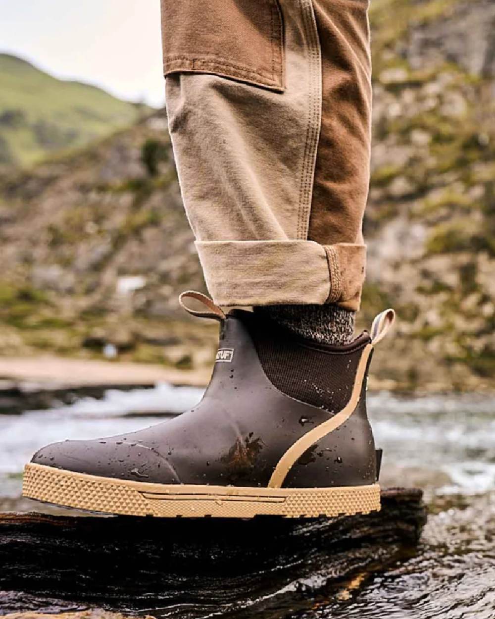 Brown Coloured Xtratuf Mens 6" Wheelhouse Ankle Boat Boots on outdoor background 