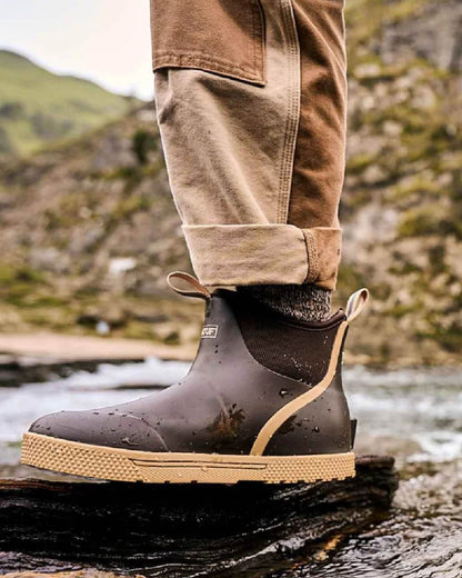Brown Coloured Xtratuf Mens 6&quot; Wheelhouse Ankle Boat Boots on outdoor background 