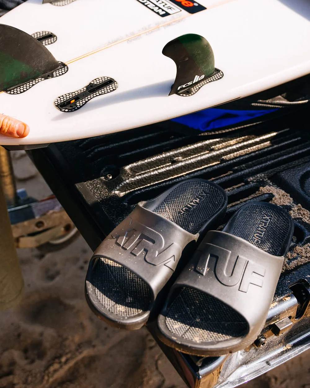 Black Coloured Xtratuf Mens Apres Fish Sliders on outdoor background 