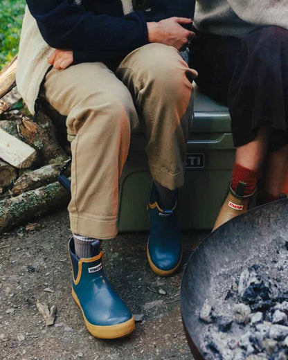 Marine Coloured Xtratuf Womens 6" Legacy Ankle Deck Boots on outdoor background 