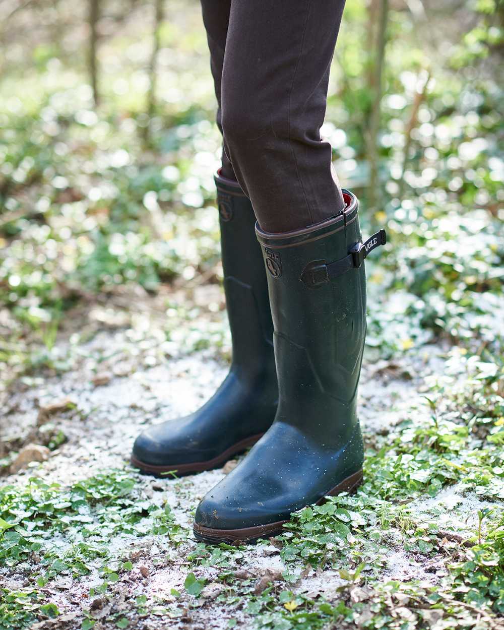 Bronze Colloured Aigle Parcours 2 ISO Open Wellingtons On A Forest Background