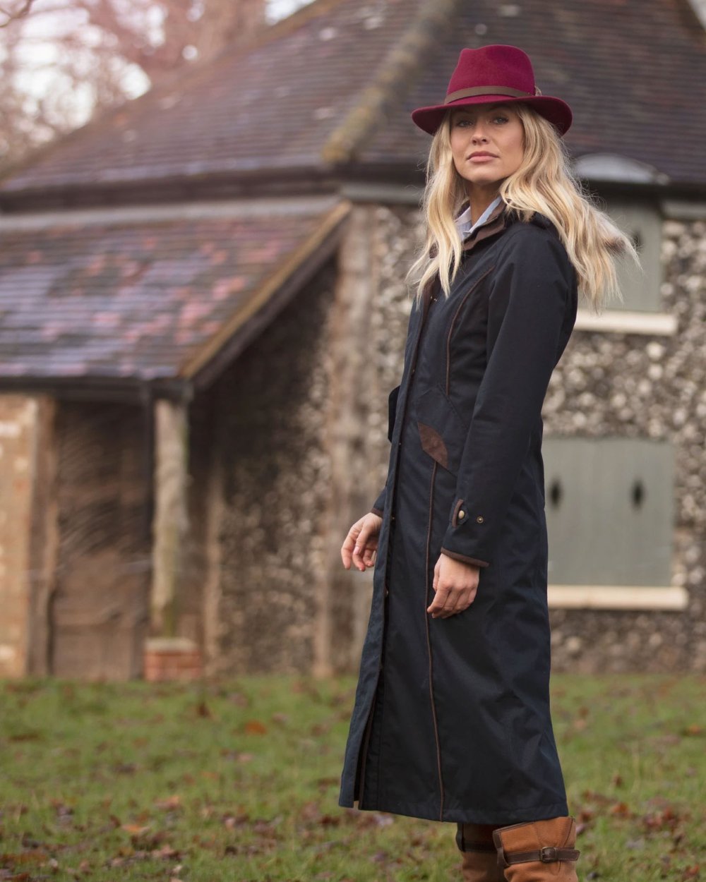 Navy Coloured Alan Paine Fernley Long Waterproof Coat On A Backyard Background 