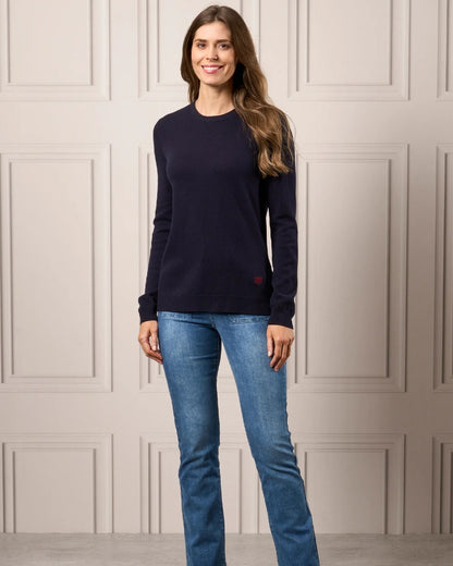 Navy Coloured Alan Paine Ladies Emma Elevated Crew Neck Jumper On A Wall Background 