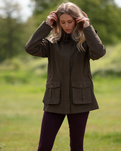 Olive Coloured Alan Paine Ladies Lockwood Jacket On A Forest Background