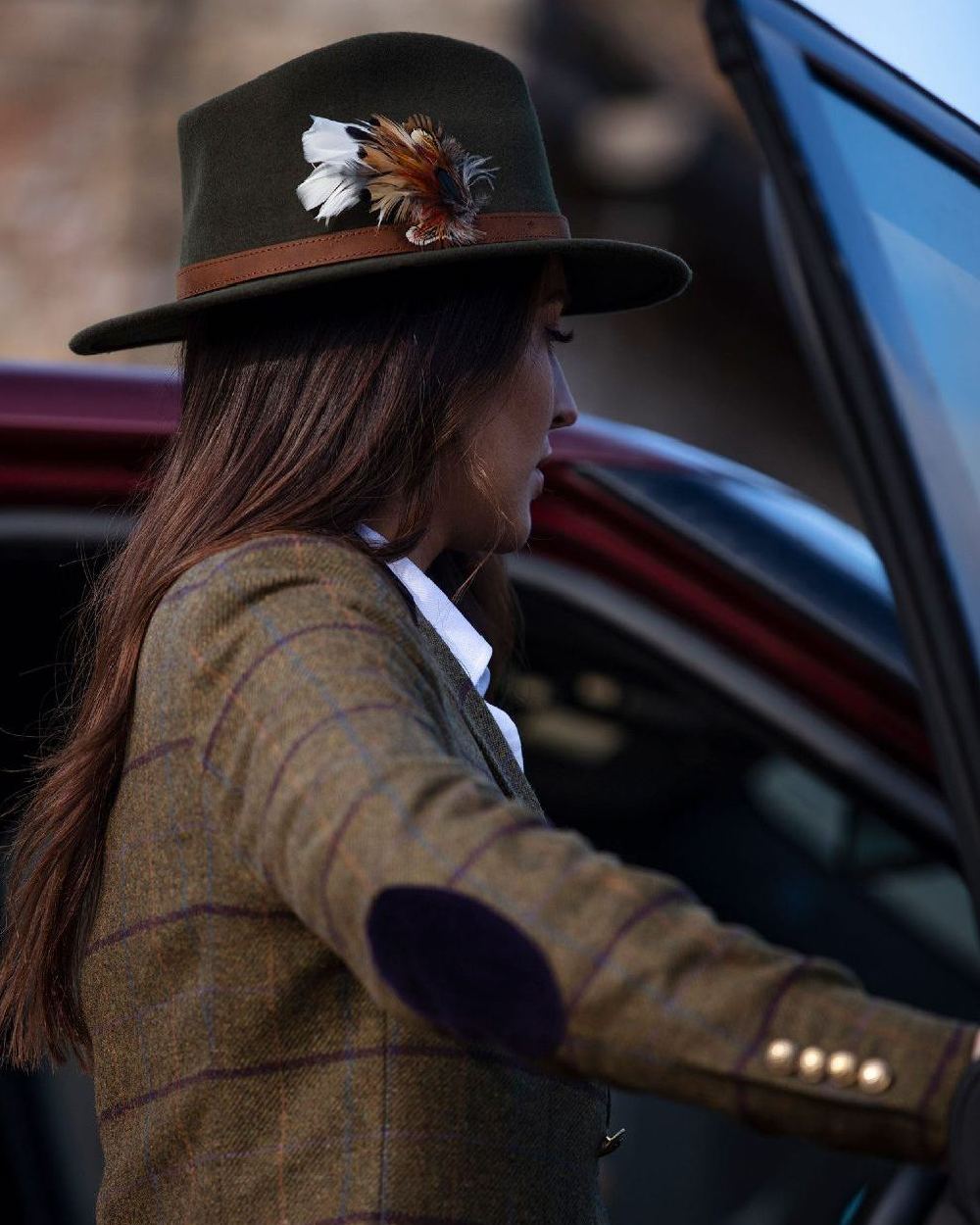 Olive coloured Alan Paine Ladies Richmond Felt Hat on blurry background 