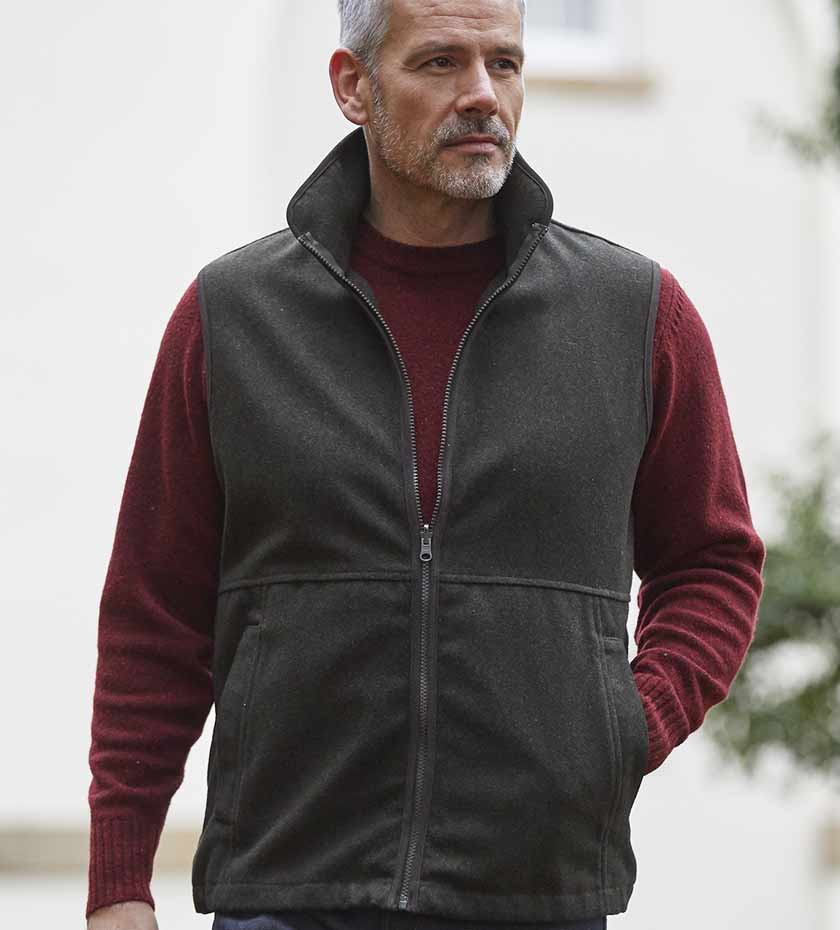 Man wearing Alan Paine Fleece gilet in green.