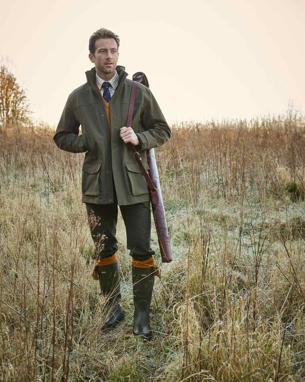 Olive Coloured Alan Paine Mens Lockwood Shooting Coat On A Forest Background