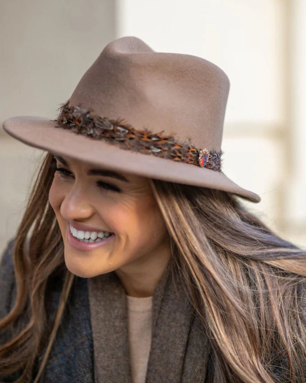 Mink Coloured Alan Paine Richmond Ladies Fedora On A Blurry Background 