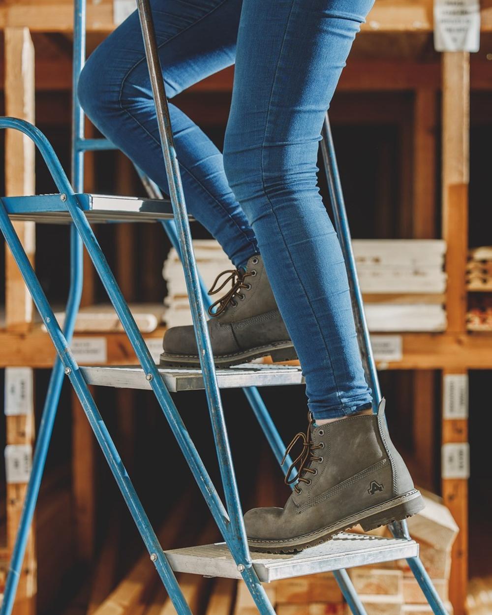 Grey Coloured Amblers Safety AS105 Mimi Safety Boots on work 
station background 