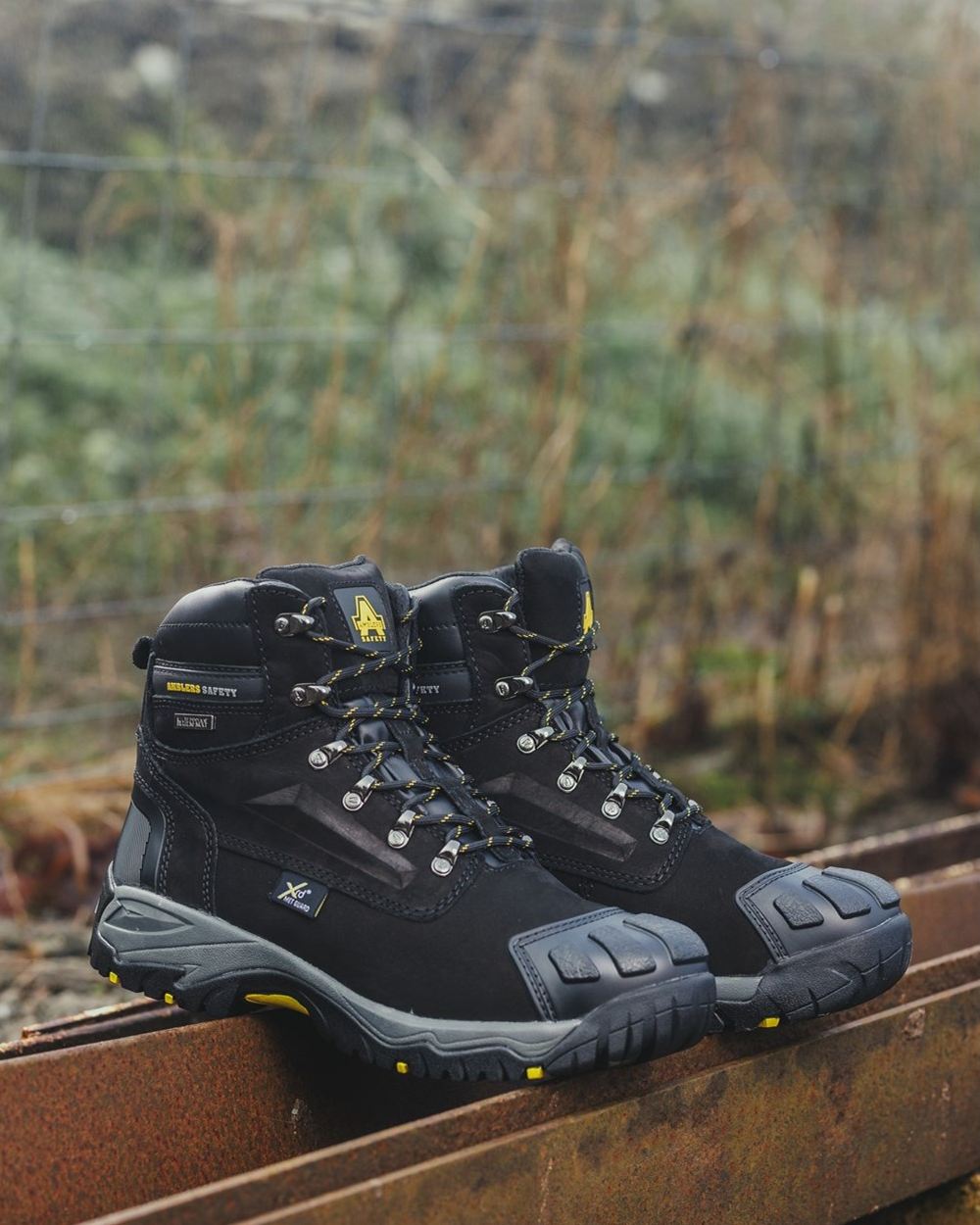 Black Coloured Amblers Safety Mens FS987 Waterproof Safety Boots on a blurry background 