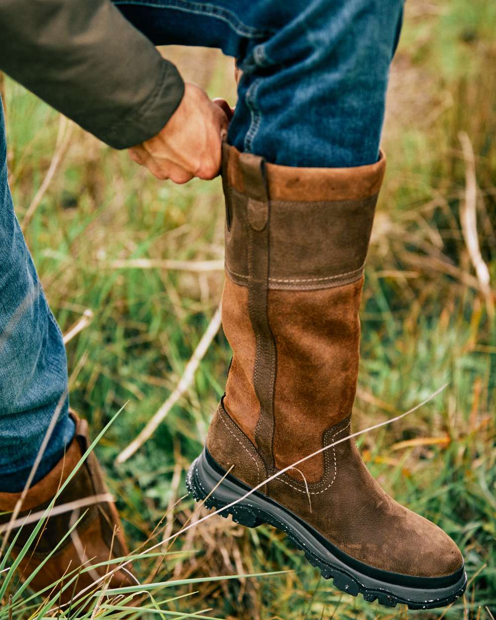 Java Coloured Ariat Moresby Tall H20 Java Country Boot On A Field Background